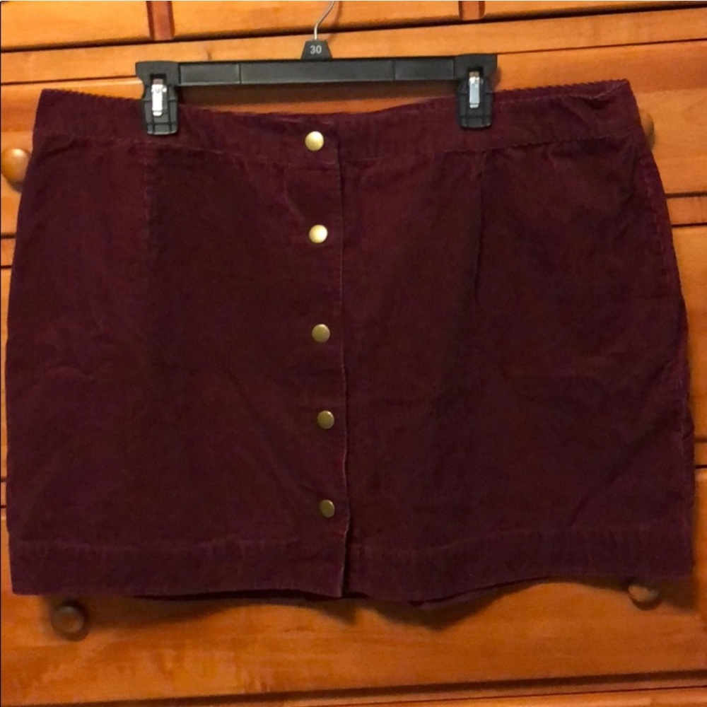 Cute maroon corduroy snap front skirt.